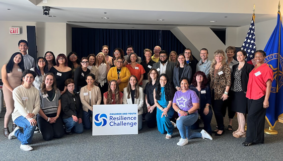 Photo of finalist presenters posing in large group at the HHS Children and Youth Resilience Challenge summit