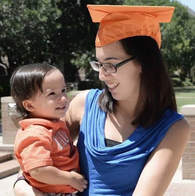 Photo of an appreciative SORTP program participant with her child.